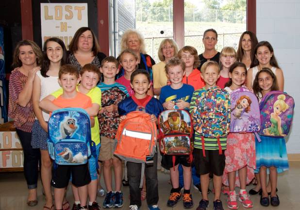 Youth Ending Hunger Club members collect backpacks, school supplies Pictured in the front row (from left) are club members Torin Breheny, Owen Breheny, Aiden Meyers, Hailey Meyers, Michael Lombardi, Luke Winkler, Max Winkler, Luka Zacharkevics, Lauren Carroll, Amanda Fernandez, Jasmine Fernandez and Marissa Lombardi. Back row, from left, parent helper Amy Winkler, club member Amanda Lombardi, parent helper Juliann Lombardi, Club Founder/Advisor Regina Botens, Advisor Catherine Faller, Teacher Advisor Sarah Scoville, and parent helper Mary Zacharkevics. (Photo provided)