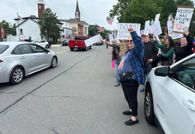 Hundreds rally in ‘No Kings Day’ protest Protesters rally passing cars to honk in Goshen.