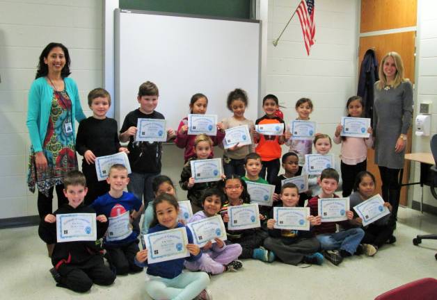Coding is 'like playing,' young programers say A happy second-grade class receives their coding certificates. Mrs. Monali Verma is on the left and Mrs. Lori Bonito on the right. Photo by Ginny Privitar)