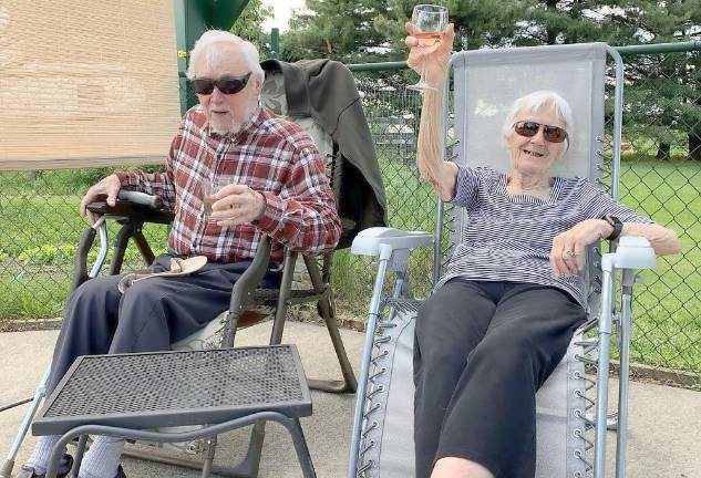 Adam and Tinie Filipowski share a toast.