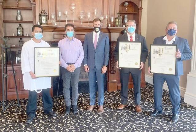 ‘This is what community is about’ Pictured from left to right are: Falkirk Estates and Country Club Executive Chef Abel Molina, Falkirk Estates and Country Club owner Wayne Corts, Assemblyman Colin J. Schmitt, Woodbury Mayor Tim Egan and Carpenters Union Local 279 Business Manager Matt Ross. Provided photo.