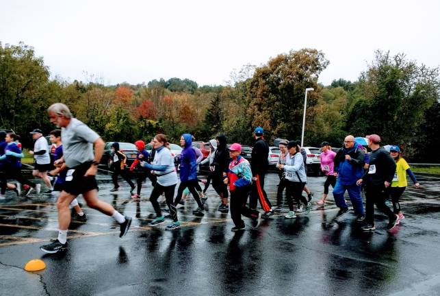 Runners take to the rain-slicked road (Photo by Ginny Privitar)