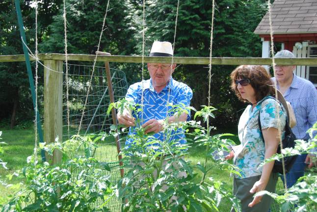 Learn how to grow your own groceries at the 11th annual Kitchen Garden Tour Klaas Vogel shows attendees his bustling veggie garden, featuring custom-made fencing, during a past Kitchen Garden Tour. Vogel is showing his garden again at this year’s event Aug 3.