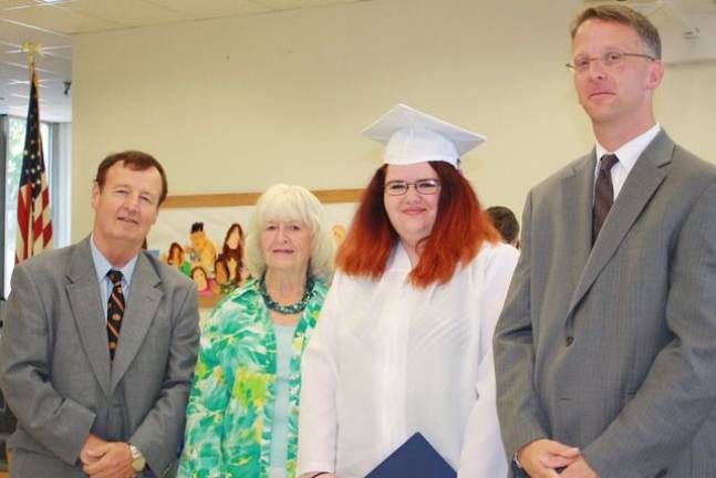 Graduate Kathleen Murphy with Superintendent Daniel Connor, Board President Judith Green and Principal Kurtis Kotes.