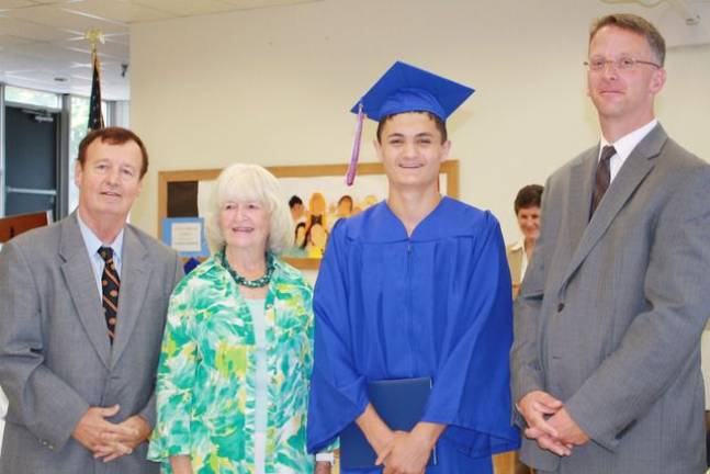 Graduate Jack Calzaretta with Superintendent Daniel Connor, Board President Judith Green and Principal Kurtis Kotes.