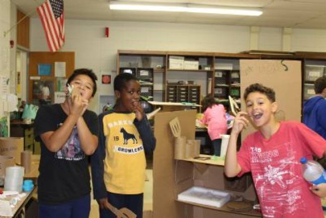 Cardboard challenge in Chester Brandi Gilbert, Tanya Sinha and Ashton Guidi with their roller coaster ride.