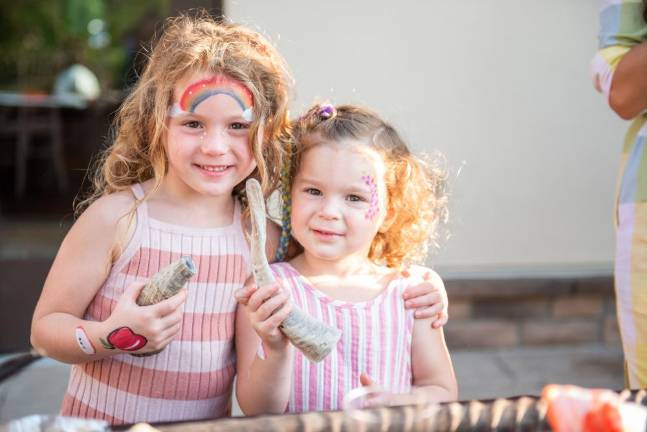 Children make their shofars at the Shofar Factory workshop at the Grand Opening Celebration of the new Chabad Center for Jewish Life.