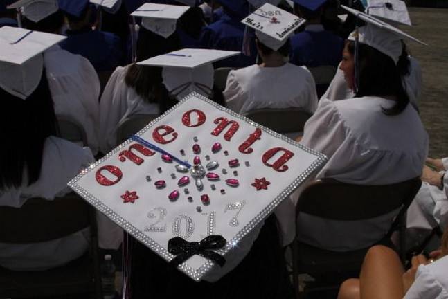 Goshen High School: 'Today as we climb' Jenna Freeman with her graduation cap with Oneonta College that looks forward to her 2017 graduation date. (Photo by Jerry Goldberg)