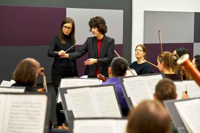 RAising the baton Erica Johansen, a workshop participant, with Diane Wittry, principal conductor of the Allentown Symphony Orchestra and the workshop’s instructor. Photo: Douglas Bain