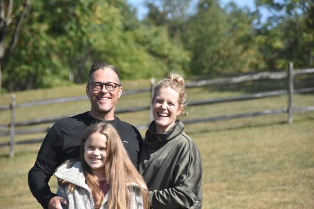 Jeff Johnson and Piper Bowman with their daughter Emory, 9. (Photo by Becca Tucker)