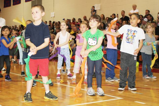 Smiles, giggles at Kindergarten Festival Kieran Doody, Brielle Wilkin and Christopher Rubiero work with scarves during one of the routines.
