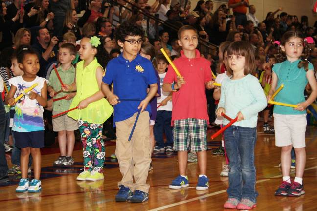 Smiles, giggles at Kindergarten Festival Loreal Campbell, Isabella Felix, Jacob Duzdevich, Grant Musson, Victoria Kimiecik, Grace Allan perform Lummi Stick Kids.