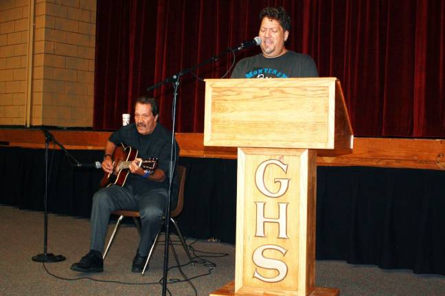 Goshen schools celebrate opening day Chris Tucci sings along with guitarist Joseph Palancia.