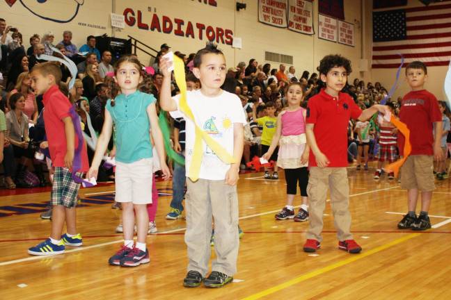 Smiles, giggles at Kindergarten Festival Grace Allan, Luca Sorice and Jovani Duzdevich perform the scarf routine.