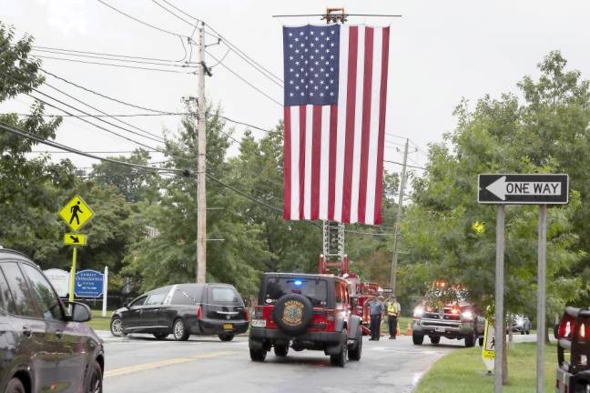 Fire departments escort body of Charles Niemann, 60-year fire service volunteer