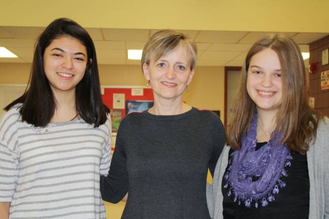 'Goshen Greats' honored for achievement in a single subject Nina Pasquini (left) and Lydia DeFusto with foreign language teacher Claire Polanis