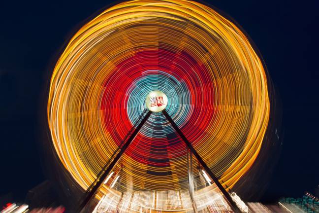 8 ways to photograph a ferris wheel Several-second exposure while moving from focused to out of focus.
