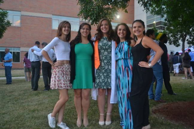 Graduate Emily Scrobe poses with her four sisters.