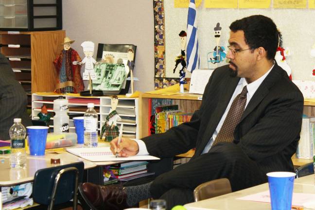 Commissioner of education visits Goshen Intermediate Dr. King takes notes during an observation of Beth Tyrrell’s classroom.