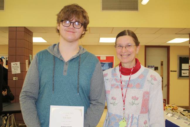 'Goshen Greats' honored for achievement in a single subject Andrew Lupinski with science teacher Laura MacGinitie