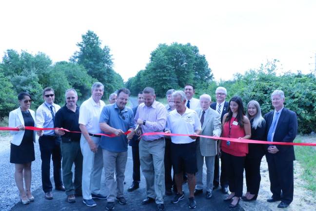 Pictured in the first row (from left): Barbara Martinez, Executive Director of the Goshen Chamber of Commerce; Travis Ewald, Orange County Deputy Commissioner of Public Works; Steve Brescia, Chair of the Orange County Legislature; James O&#x2019;Donnell, Orange County Legislator; Jim Brooks, Orange County Parks Commissioner; Steve Neuhaus, Orange County Executive; Michael Paduch, Orange Couunty Legislator; Doug Bloomfield, Town of Goshen Supervisor; Stephanie Kistner, Orange County Tourism Coordinator; Jiana Barker, Orange County Tourism Assistant; and Harry Porr, Deputy Orange County Executive. Second row: Michael Amodio, Orange County Deputy Commissioner of Parks; and Orange County Legislators Joel Sierra, John Vero, Rob Sassi, and Barry Cheney. (Photo provided)