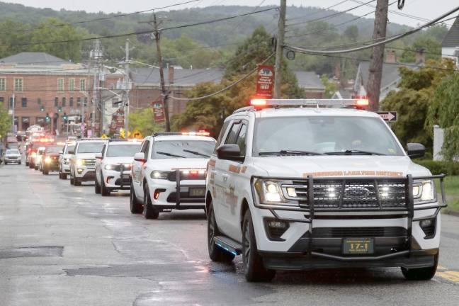 Fire departments escort body of Charles Niemann, 60-year fire service volunteer