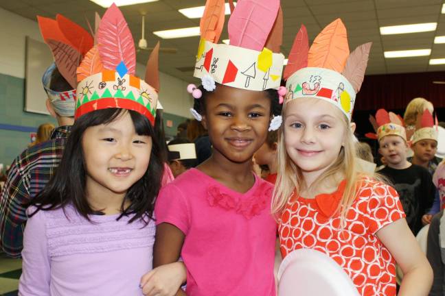 First graders throw Thanksgiving feast Isabella Ok, Abigail Thomas and Briana Lumezi are thankful for their friendship (Photo provided)