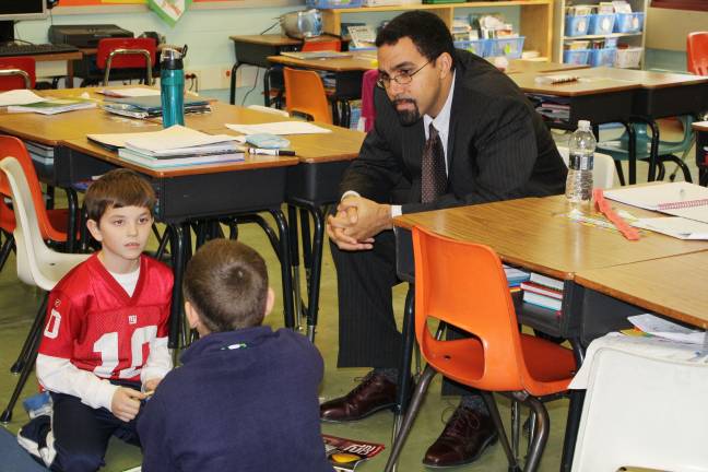 Commissioner of education visits Goshen Intermediate Dr. King talks with third graders Max Lederman and Ryan Howell about what they’re learning in school.