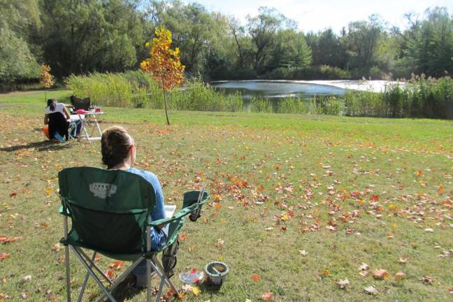 Creativity under an open sky Samantha Gatto paints the beautiful scenery.
