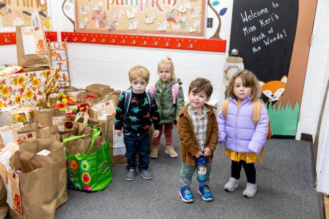 Local school teaches the importance of giving Students of G.A.P.N.S (Goshen Area Parent Nursery School) collected donations for Goshen Food Pantry for their Thanksgiving Harvest Food Drive. In addition to the students collecting food, Shoprite of Chester store director Jack DeLuca donated the paper bags used to hold the donated goods. Photo by Sammie Finch