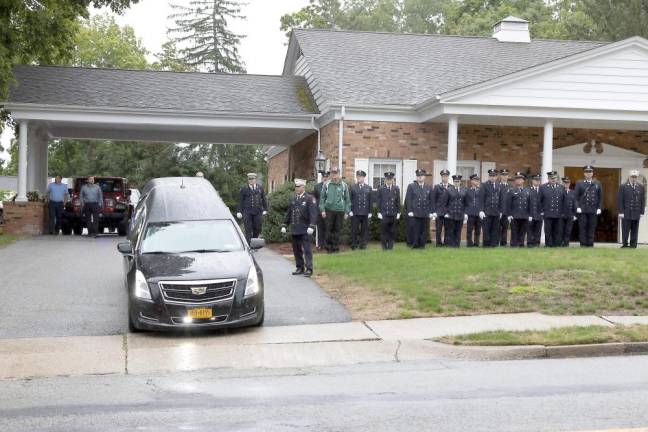 Fire departments escort body of Charles Niemann, 60-year fire service volunteer