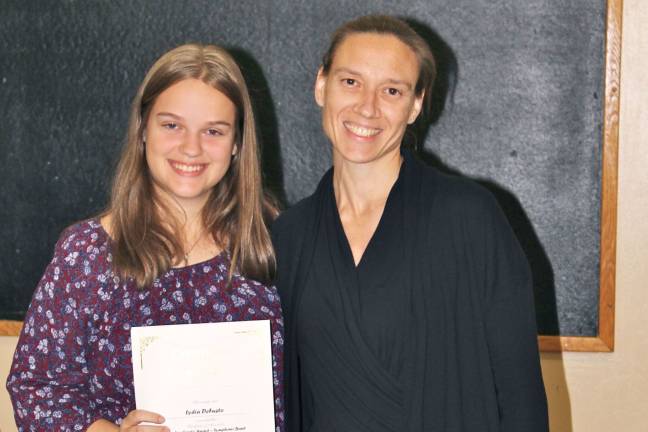 High school students honored as 'Goshen Greats' Lydia DeFusto with music teacher Kim Longo
