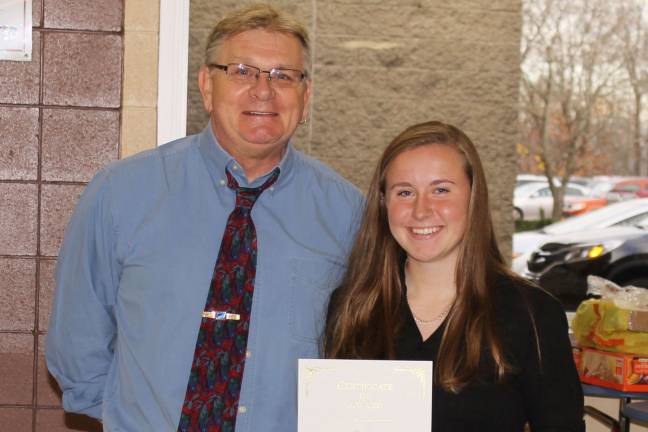 High school students honored as 'Goshen Greats' Kelly Fellenzer with English teacher Marlin Maduras