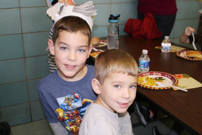 First graders throw Thanksgiving feast Jackson Laviano is happy to enjoy the feast with his little brother. (Photo provided)