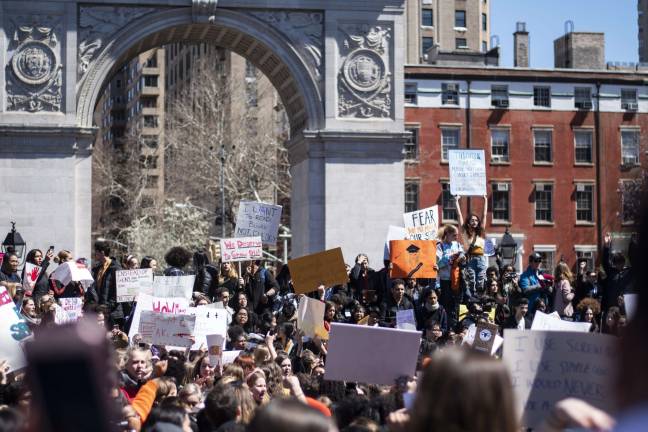 Several hundred mostly high school students converged on Washington Square Park Friday to call on stronger gun-control laws. Photo: Jeremy Weine