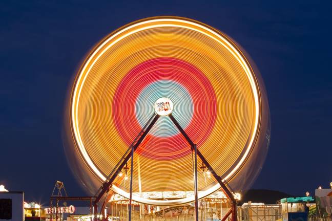 8 ways to photograph a ferris wheel The ferris wheel looks like a nice smooth light colored circle as it moves around during a several-second exposure.