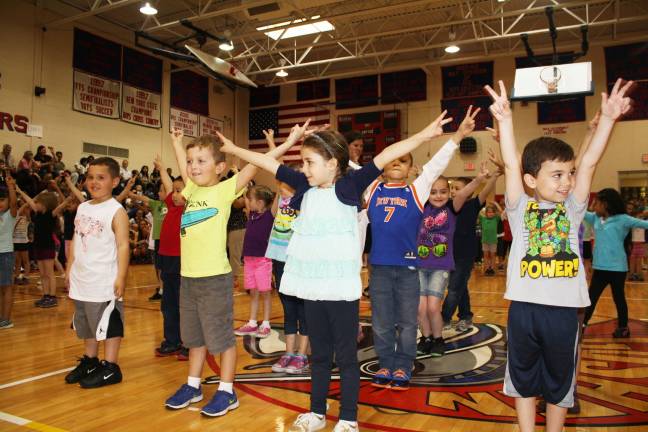 Smiles, giggles at Kindergarten Festival Noah Berrios, Ben Bockman, Mary Ann Mitchell and Sean Thomas.