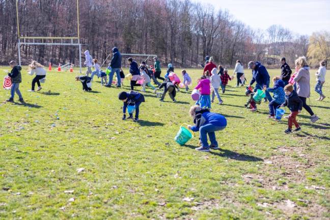 Kids raced to collect Easter eggs at the PBA annual Easter Egg Hunt at Chester Commons Park. Photo by Sammie Finch