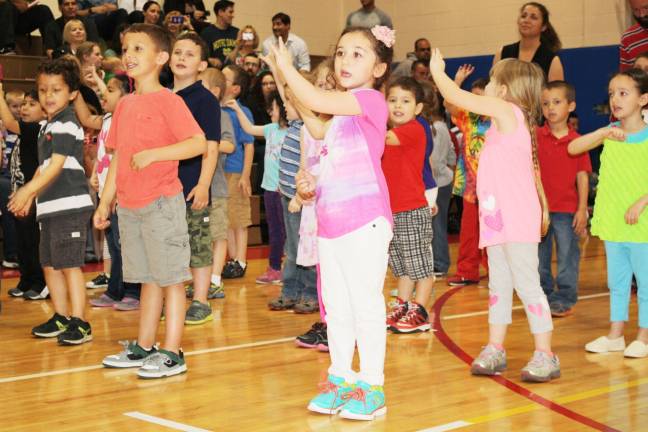 Smiles, giggles at Kindergarten Festival Colby Bridges and Danielle Rosario.