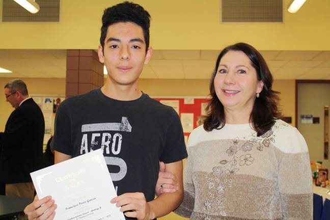 'Goshen Greats' honored for achievement in a single subject Francisco Perez with science teacher Deborah Schulz