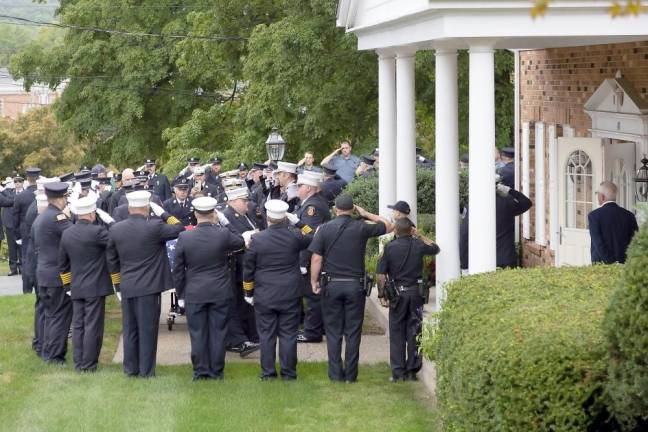 Fire departments escort body of Charles Niemann, 60-year fire service volunteer