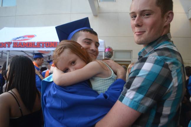 Graduate Liam Heslin shares a moment with his neice.