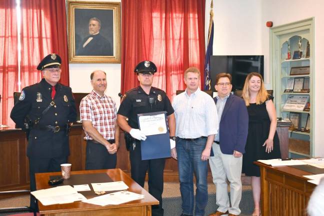 Left to Right, Chief James Watt, Trustee Tony Scotto, Ptl. Jeremy M. Harter, Mayor Scott Wohl, Trustee Jonathan Rouis, Police Commissioner Molly O’Donnell.