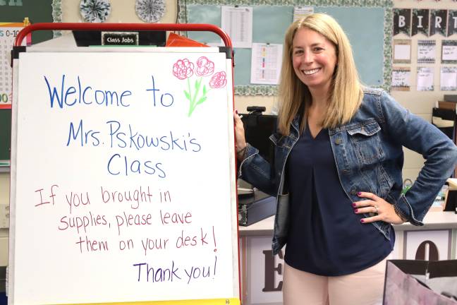 Superintendent’s Conference readies school, staff for new year Angela Pskowski, who teaches first grade teacher at Chester Elementary School, welcomes students to class. Photo provided