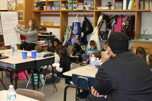 Commissioner of education visits Goshen Intermediate Beth Tyrrell, third grade teacher, teaches while Dr. King observes-