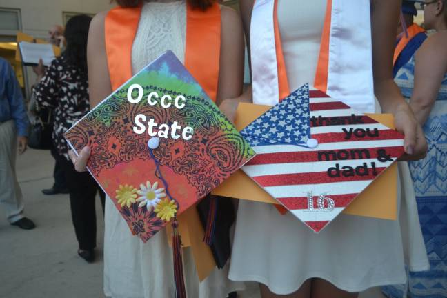 Two decorated caps from the Chester Academy graduation.
