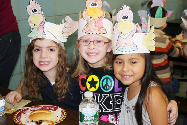 First graders throw Thanksgiving feast Julianna Bonito, Adrianna Artrip and Melanie Sanchez think Thanksgiving is fun. (Photo provided)