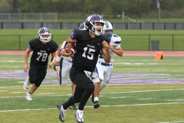 Crusaders quarterback David Fennessy scored on this 42-yard touchdown run.