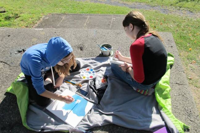 Creativity under an open sky Skylar Miller and Christina Cabrera work together at Salesian Park.
