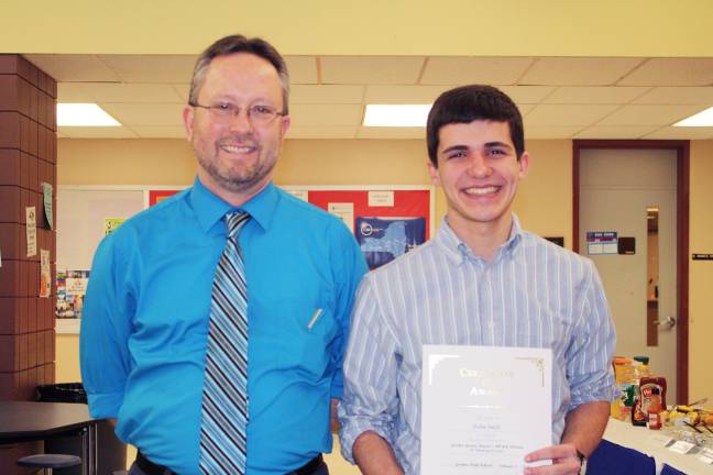 'Goshen Greats' honored for achievement in a single subject John Swift with social studies teacher James Polanis